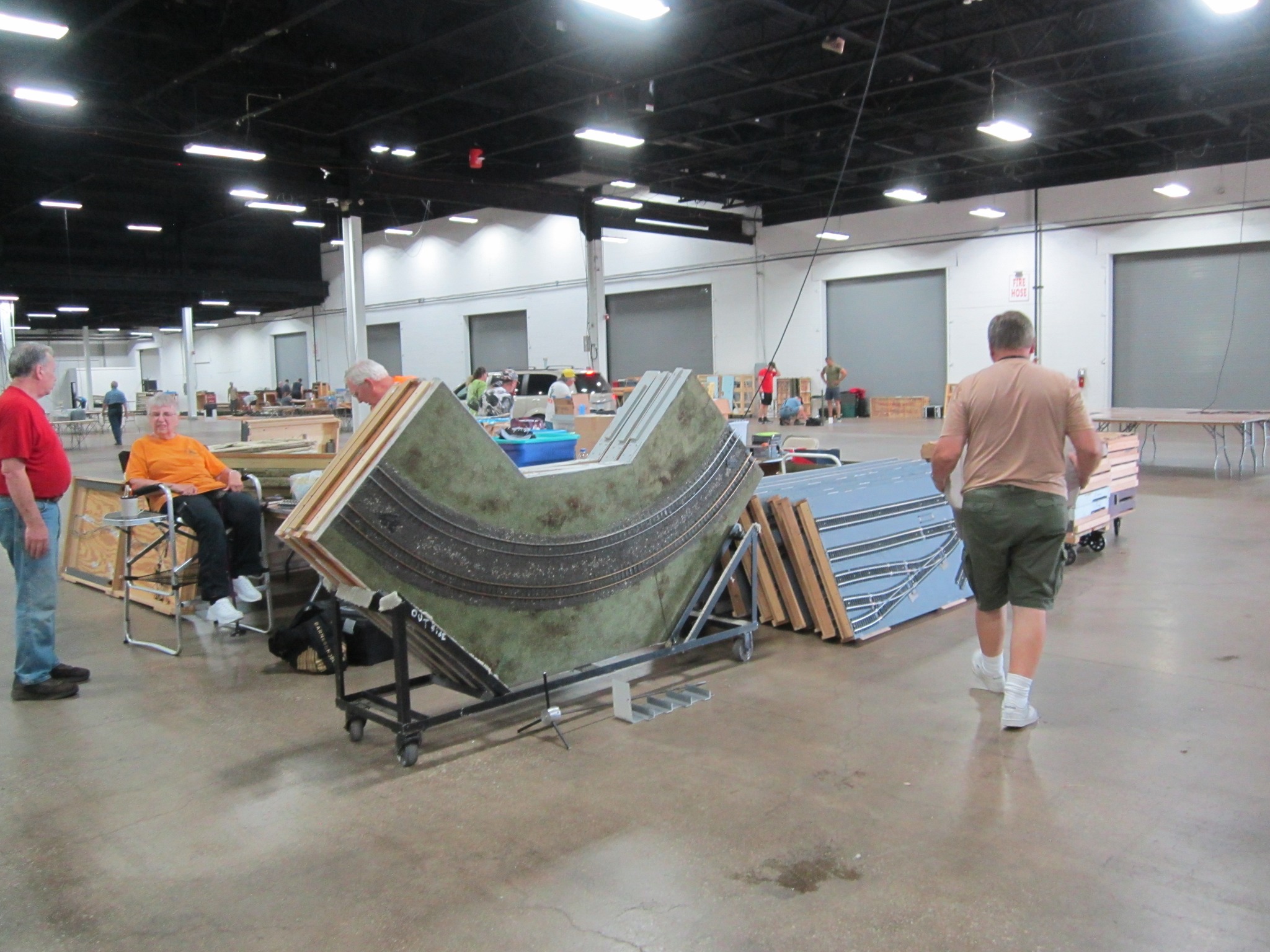 Club members setting up the modular display